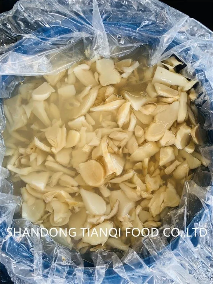 Slice king oyster mushroom in brine in drums